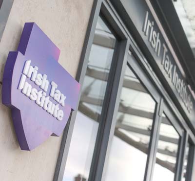 Photo of the Institute logo outside its office in Grand Canal Harbour.